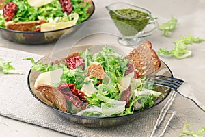 Frisee lettuce salad with sun dried tomatoes