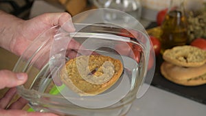 the frisella is put in water to moisten before being eaten