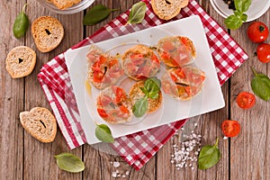 Friselle with cherry tomatoes and basil.