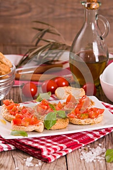 Friselle with cherry tomatoes and basil.