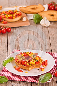 Friselle with tomatoes and mais.