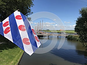 Frisian flag with skutsjes in Sloten