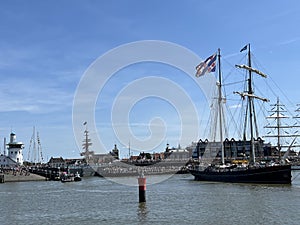 Frisian sailship leaving the harbor of Harlingen