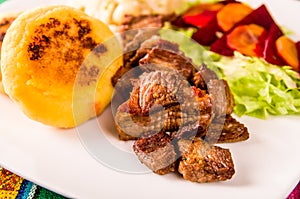 Fritada, fried pork, traditional ecuatorian dish.