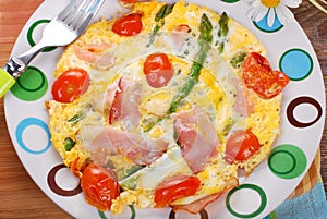 Frittata omelet with asparagus,tomato and ham