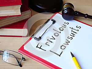 Frivolous lawsuits is shown on the conceptual photo using the text photo