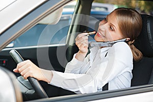 Frivolous woman driving the car