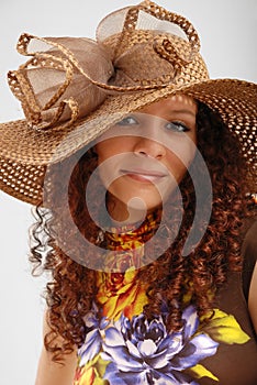 Frizzy girl in the hat wide-brimmed.