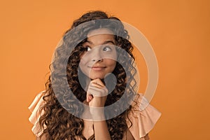 frizzy hair curl. girl has wavy hairdo. portrait of frizz child. express positive emotion.