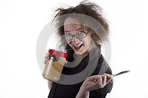 Frizzy Haired Girl Holding Peanut Butter and Knife