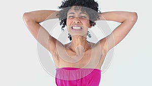 Frizzy haired woman grabbing her hair