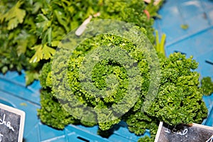 Frizzy parsley in a transport box at the weekly market