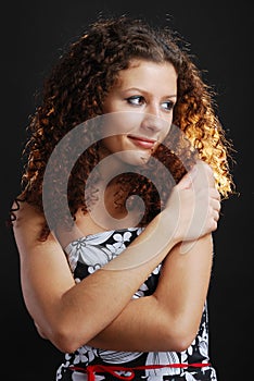 Frizzy woman with cross arms