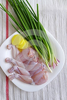 Frog legs prepared, cooking ingredients