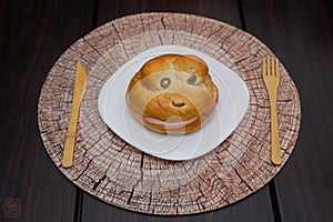 FROG SHAPED BREAD WITH HAMM and bamboo cuterly  on a wooden table