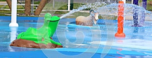 Frog and Sheep Spraying Water At A City Splash Park
