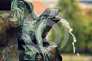 Frog splashing water on fountain, water scarcity concept, Petrin, Prague