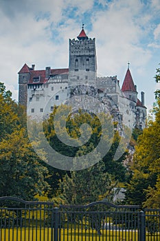 Frog view of Bran castle or famous Dracula's castle, close to Bran, Romania on a cloudy summer day
