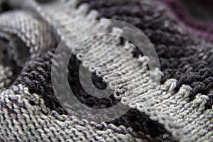 Knitted fabric with liv stitches in gray and lilac photo