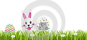 Frohe Ostern - Osterei und Osterhase. Happy Easter with Easter egg and Easter bunny.