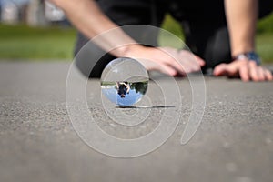 Frolicsome with brother and lens ball on the path in Greenwich park, London, United kingdom. Glass ball jumps across road.