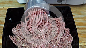 Front and above view of grinding of minced meat and onion