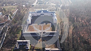 Front aerial view of the Vyshnivets Palace, Ukraine, in autumn. Picturesquere therritory.