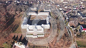 Front aerial view of the Vyshnivets Palace, Ukraine, in autumn. Picturesquere therritory.
