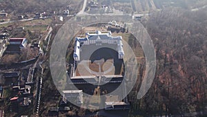 Front aerial view of the Vyshnivets Palace, Ukraine, in autumn. Picturesquere therritory.