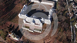 Front aerial view of the Vyshnivets Palace, Ukraine, in autumn. Picturesquere therritory.