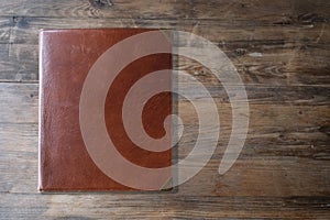 Front Back of Restaurant Menu Folder in Brown Leather on white background, empty mock up