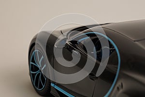 Front of black Bugatti Chiron with blue trim toy car