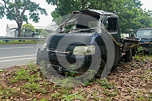 Front of black car get damaged by accident on the road