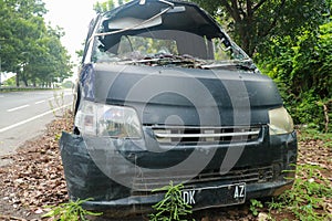 Front of black car get damaged by accident on the road