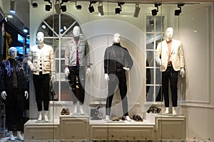 Man clothing boutique shop window mannequins photo