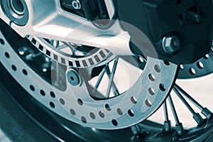 Front brake discs and wheel on a motorbike