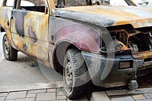 The front of the burned-out compact car.