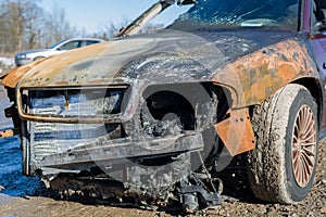 Front of burnt out abandoned car, insurance claim