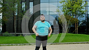 In front of the camera obese young man very funny dancing and doing aerobic to loose the weight concept of healthy