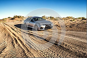 Front of the car business class silvery in the desert