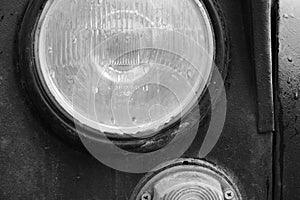Front circular headlight of a vintage soviet car