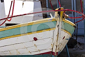 Front close-up shot of colorful green and white fishing boat in Kalloni at Lesvos