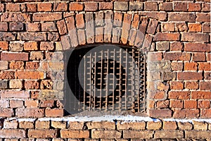 Front close-up view of a vintage brick with a window - Image