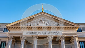 Front of the Congress of Deputies with the Spanish flag in the city of Madrid.