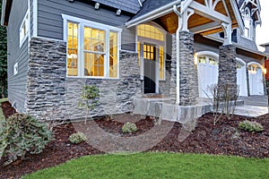 Front covered porch design with stone columns