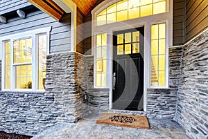 Front covered porch design with stone columns