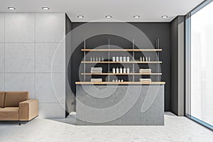 Front desk with bathware at the dark grey wall
