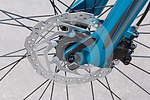 Front disk brake of bicycle, close-up in selective focus