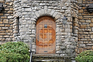 front door of house built of rough hewn stone