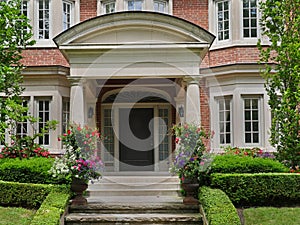 Front door of house with large portico